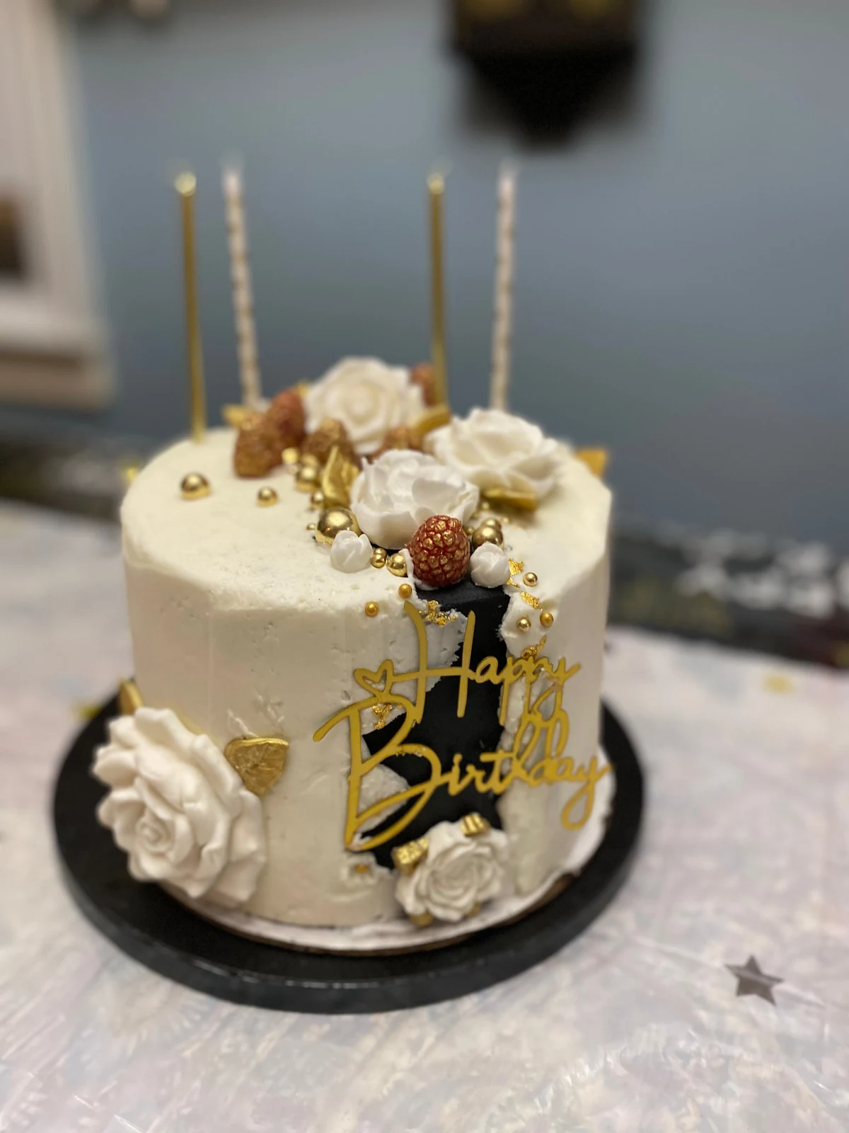 Ivory and gold birthday cake with handmade flowers